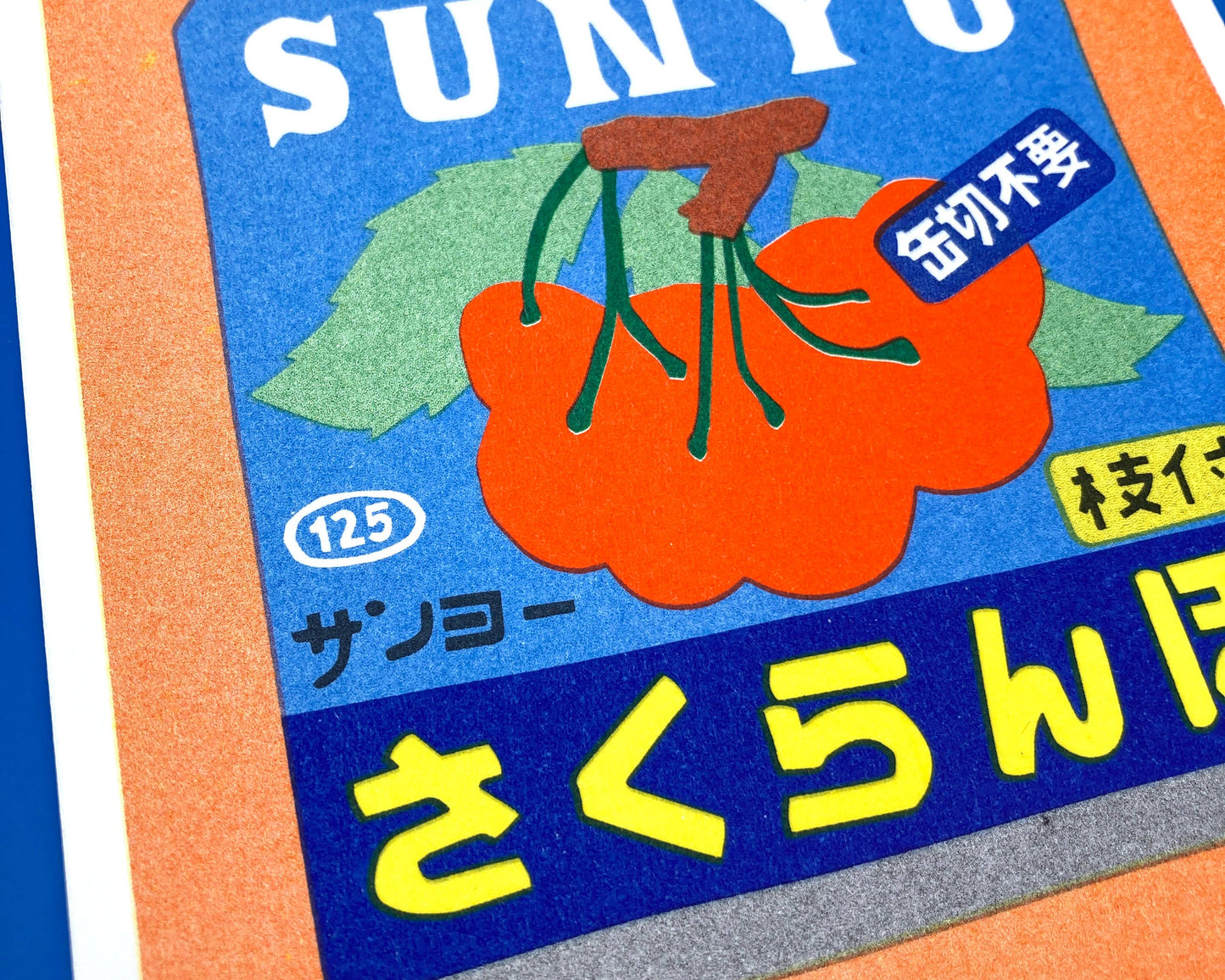 A risograph print of a canned cherries